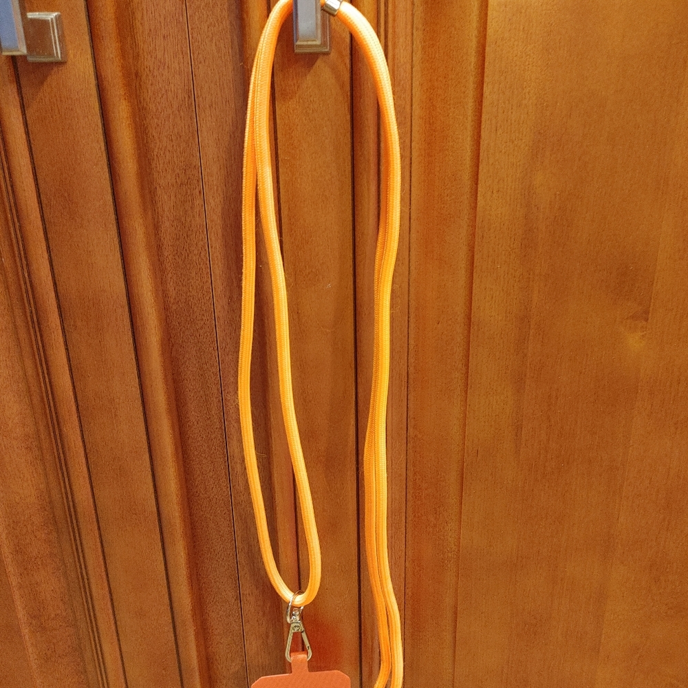 Cell phone lanyard and card. Orange. Nwot.